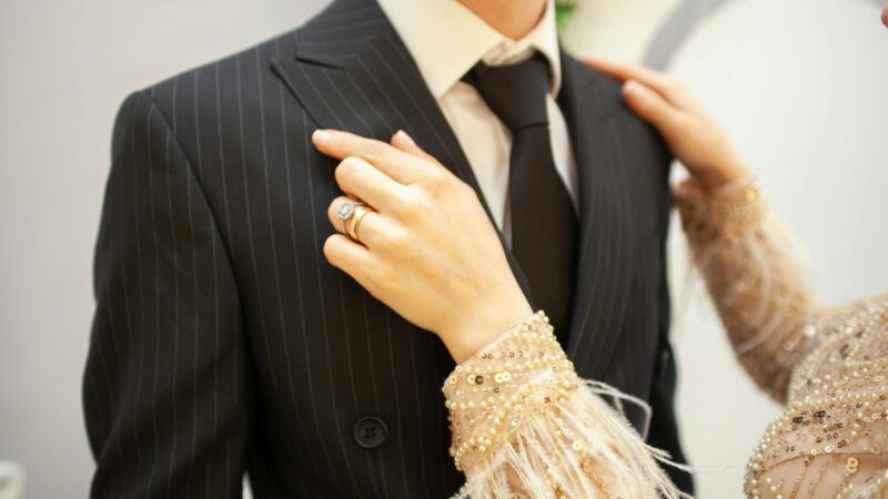 a man and woman wearing a suit