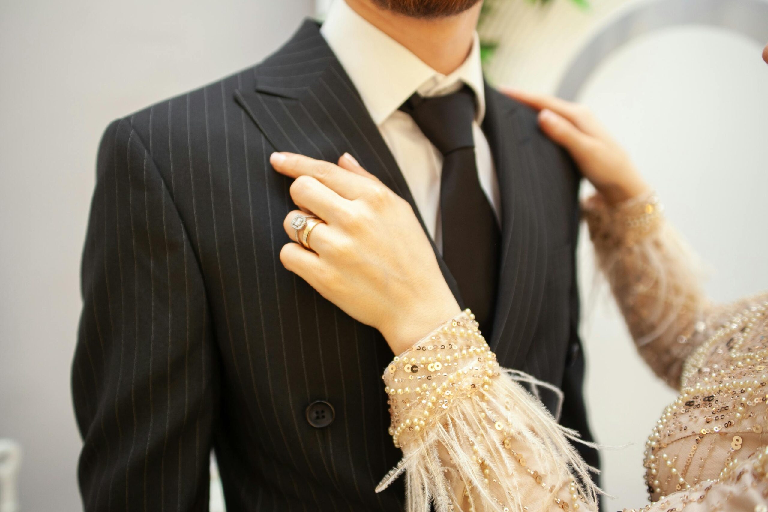 a man and woman wearing a suit