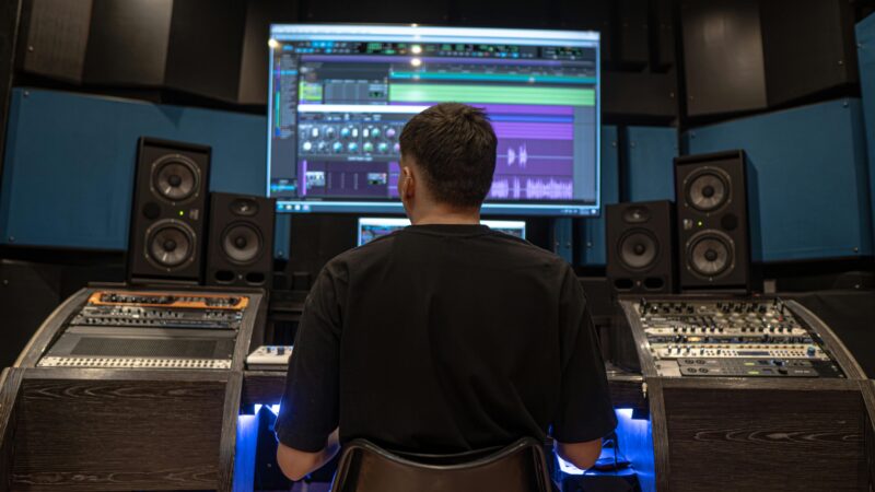 a man sitting in front of a computer