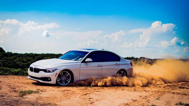 a car driving on a dirt road